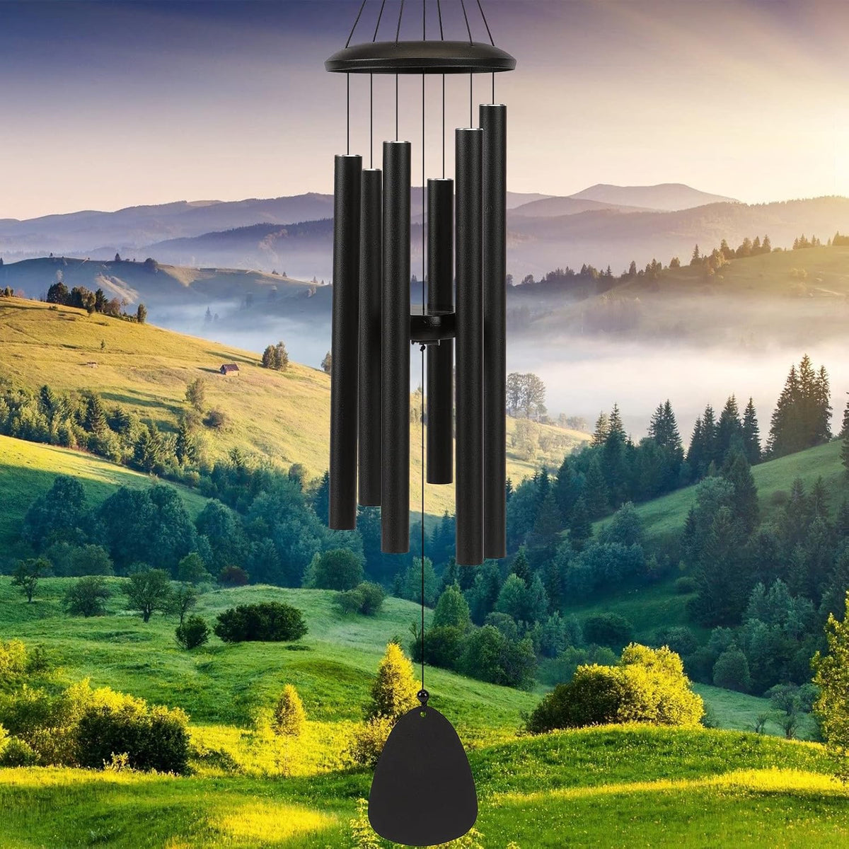 Black aluminum outdoor wind chime against a landscape background