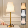 Gold cordless table lamp with light shade and touch control