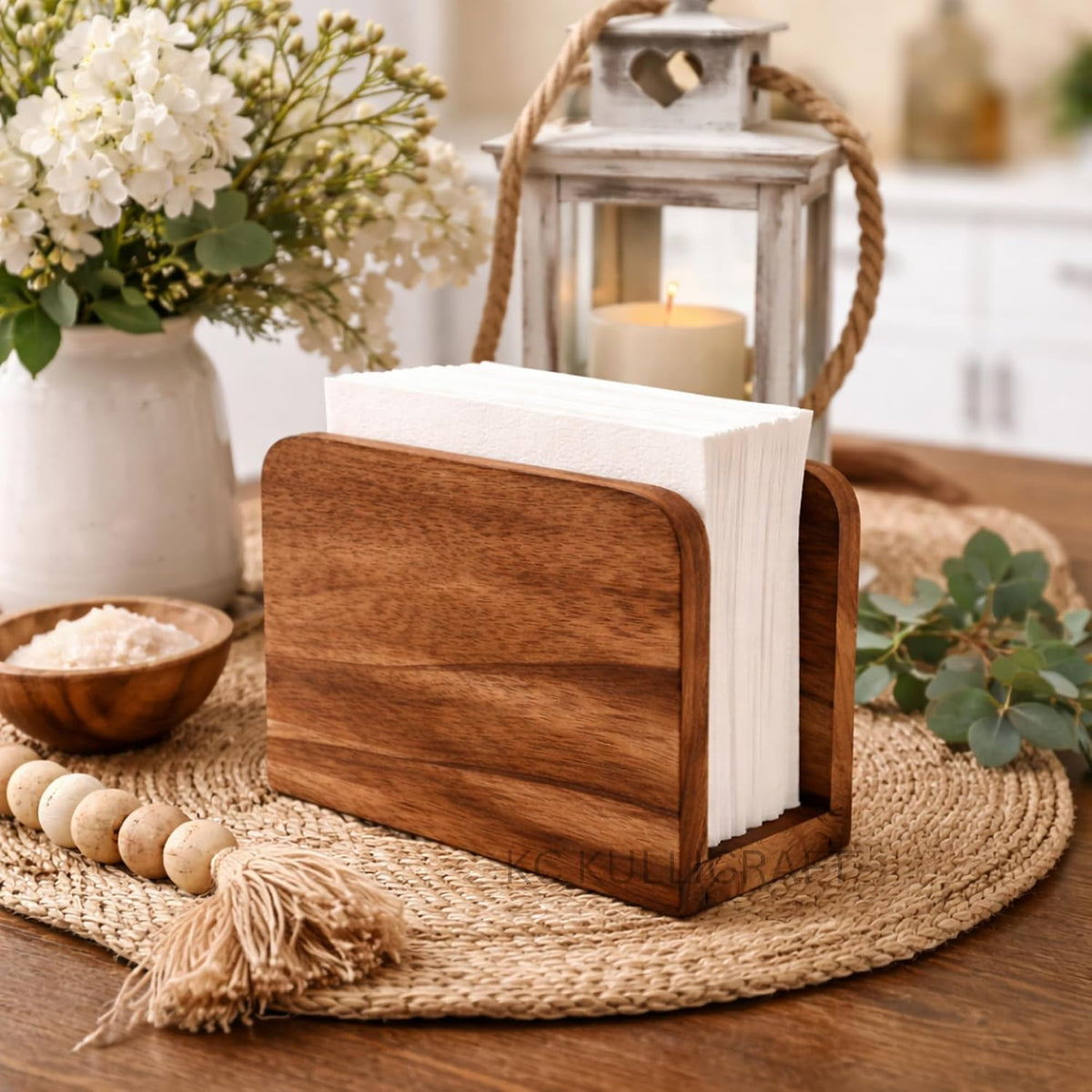 Mango wood napkin holder styled on a dining table; accessories not included