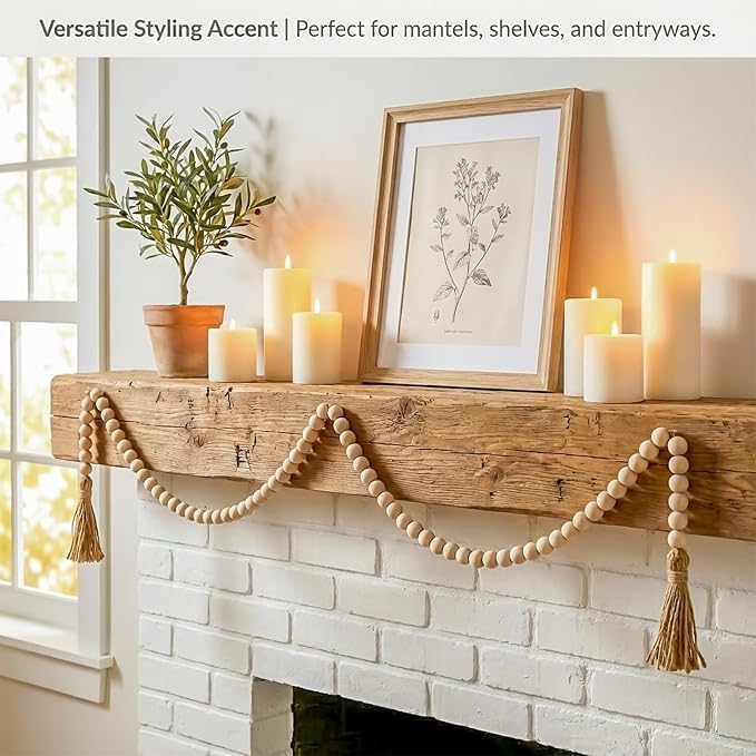 Natural wood bead garland styled along a mantel; accessories not included