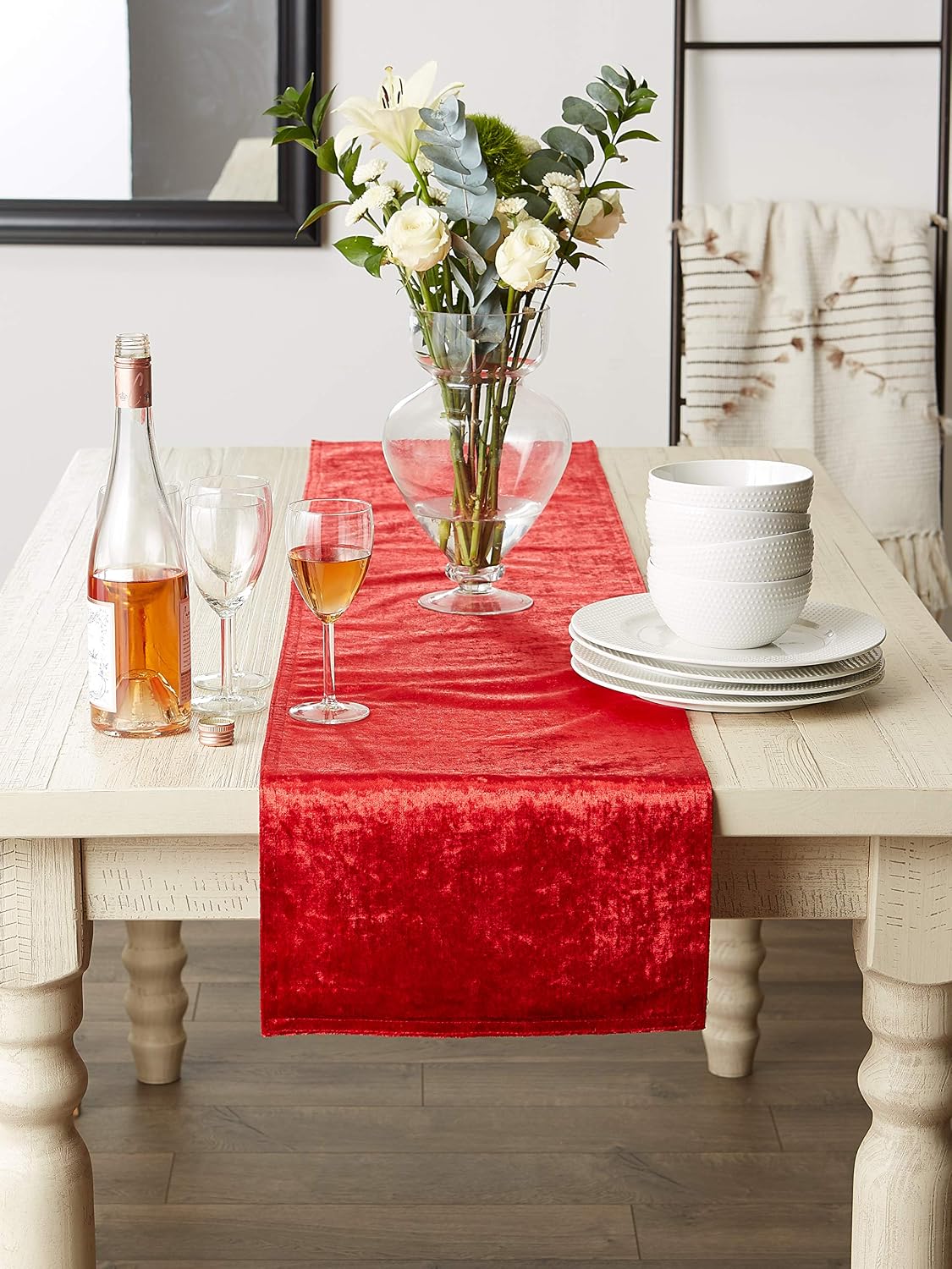 Red velvet table runner styled on a dining table; tableware and decorations not included