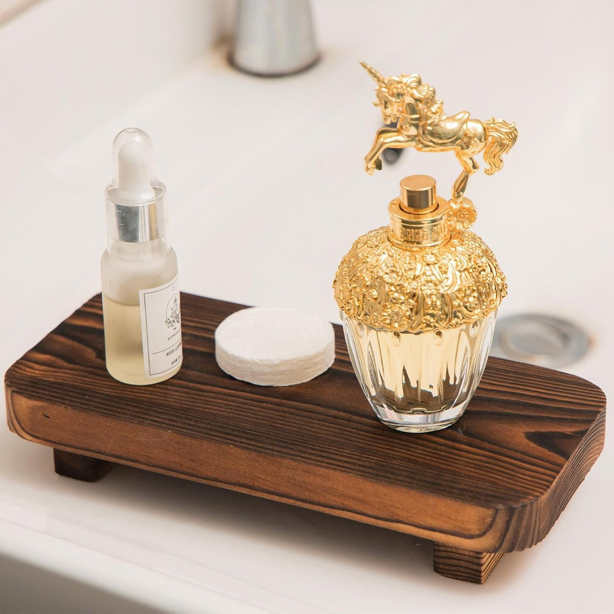 Brown wooden riser styled with perfume and skincare; accessories not included